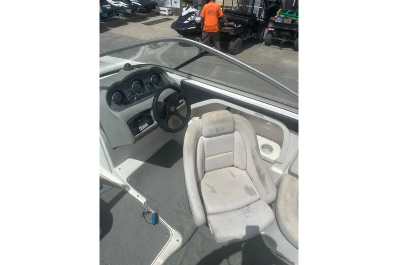 Slide: The Image of 2008 Yamaha Boats SX230 interior with steering wheel and dashboard controls. - 10