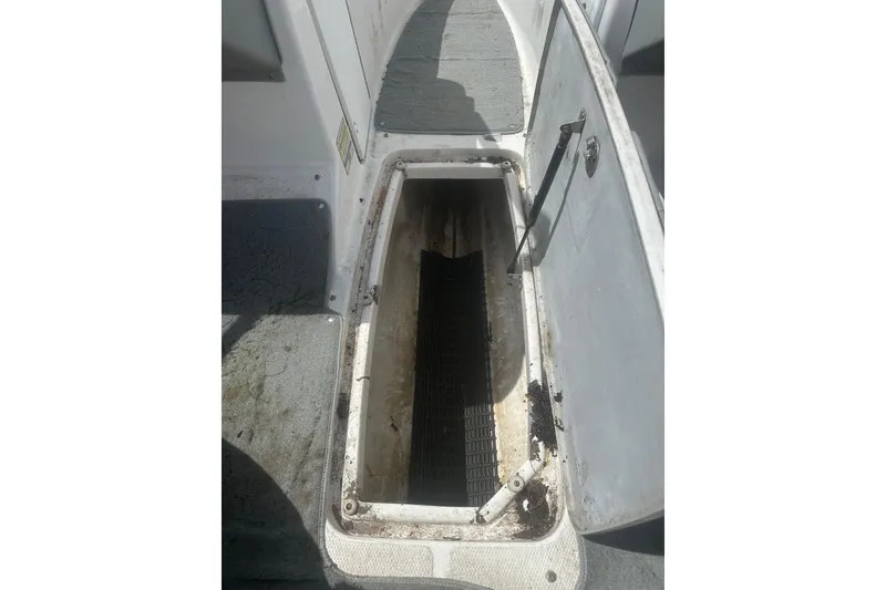 Slide: The Image of Open storage compartment on a 2008 Yamaha Boats SX230, showing interior details. - 20