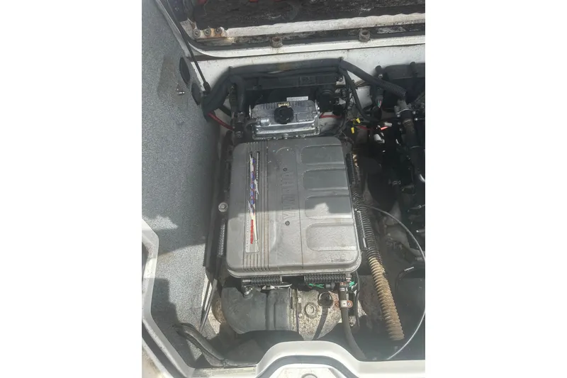 Slide: The Image of Engine compartment of a 2008 Yamaha Boats SX230, showcasing internal components. - 21