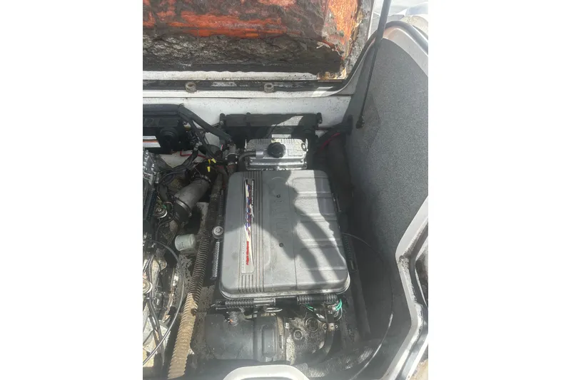 Slide: The Image of 2008 Yamaha Boats SX230 engine compartment with visible components and wiring. - 22