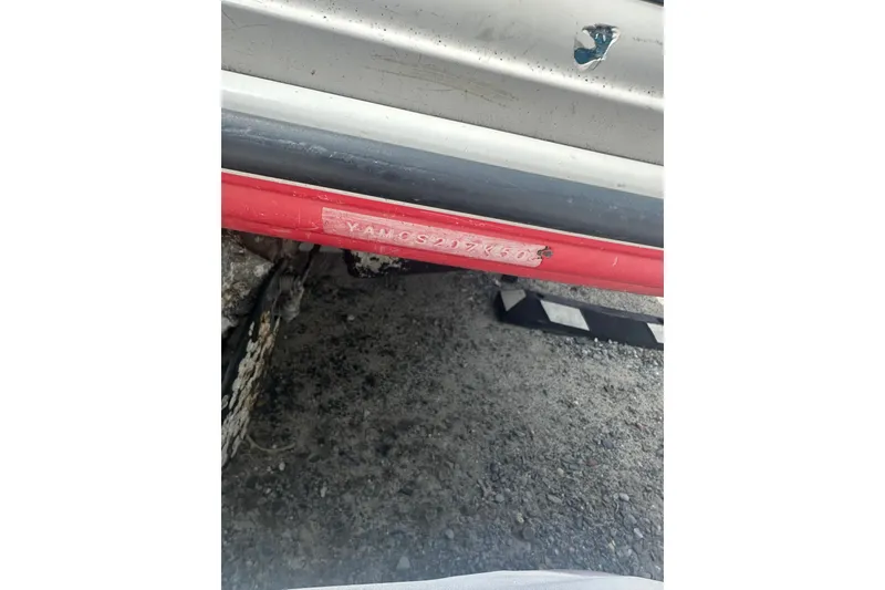 Slide: The Image of 2008 Yamaha Boats SX230 hull identification number on red and gray boat exterior. - 24