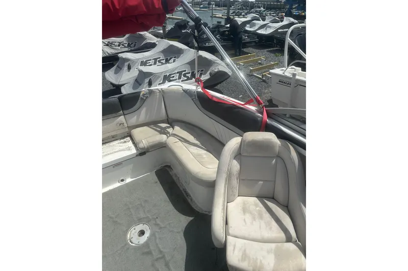 Slide: The Image of 2008 Yamaha Boats SX230 interior with white seating and red canopy. - 9