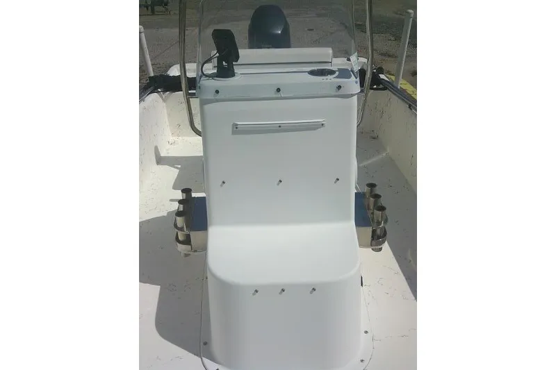 Slide: The Image of 2010 Key West 197 Skiff boat interior with steering console and seating. - 11