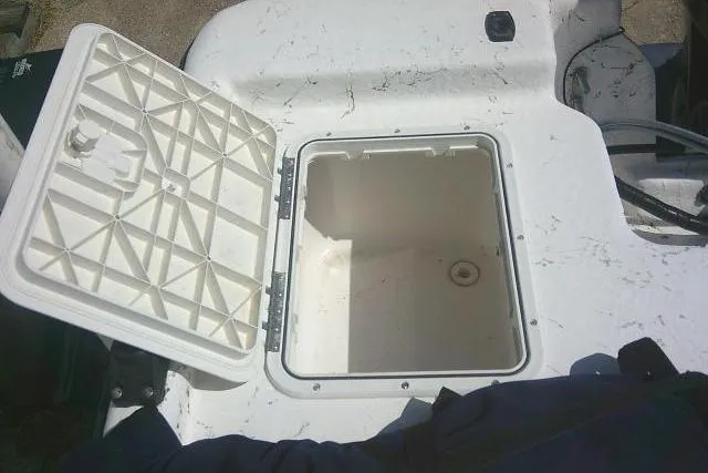 Slide: The Image of Open storage compartment on a 2010 Key West 197 Skiff boat. - 17
