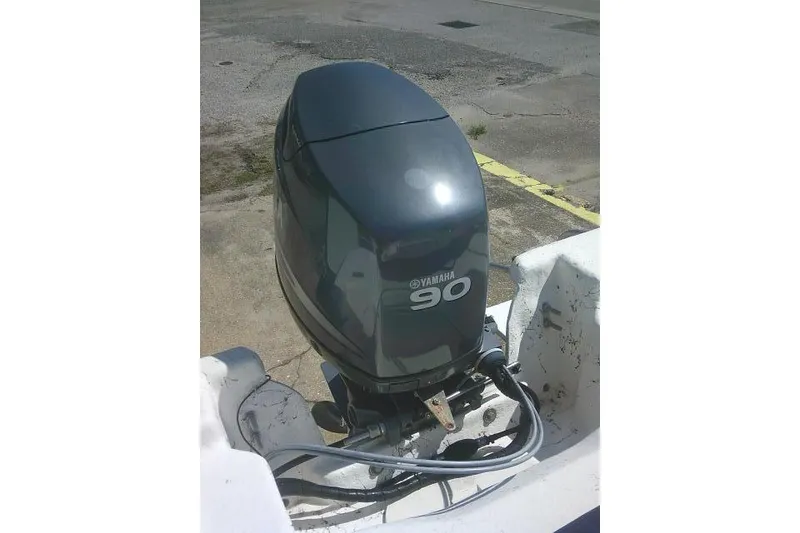 Slide: The Image of Outboard motor on a 2010 Key West 197 Skiff, featuring a Yamaha 90 engine. - 18