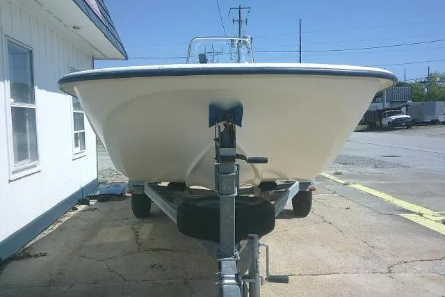 Slide: The Image of 2010 Key West 197 Skiff boat on trailer, parked outdoors. - 3