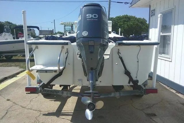 Slide: The Image of Rear view of a 2010 Key West 197 Skiff with a 90 horsepower outboard motor. - 6