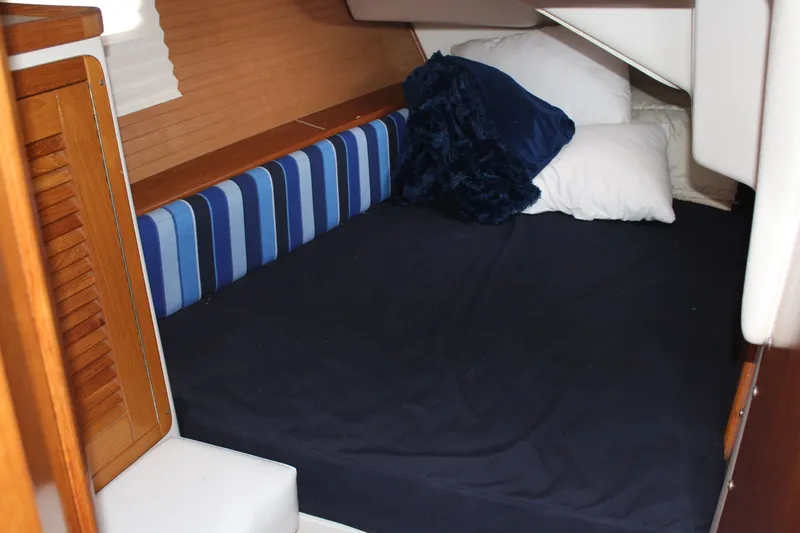 Slide: The Image of Interior of a 2004 Catalina 42 MkII yacht with cozy sleeping area. - 11