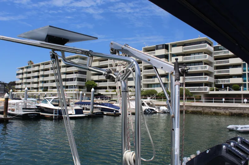 Slide: The Image of Catalina 42 MkII 2004 docked near modern buildings. - 15