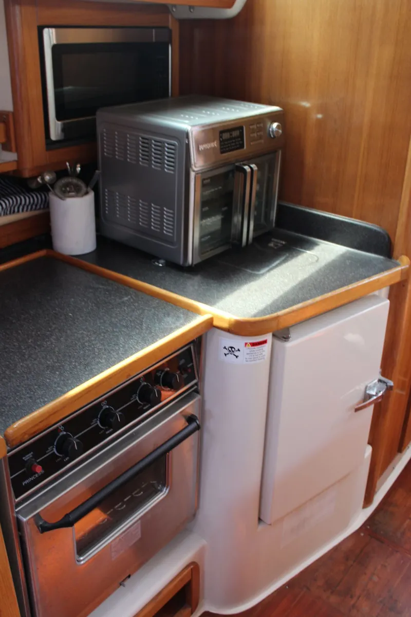 Slide: The Image of Galley of a 2004 Catalina 42 MkII yacht with oven and microwave. - 23
