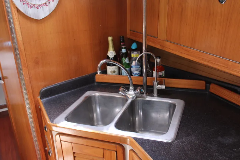 Slide: The Image of Galley area of Catalina 42 MkII yacht, double sink and beverages. - 31