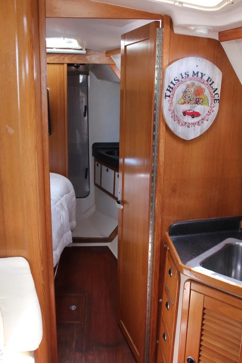 Slide: The Image of Interior of a 2004 Catalina 42 MkII yacht with wooden finish. - 32