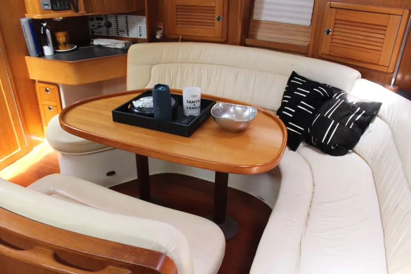 Slide: The Image of Interior of a 2004 Catalina 42 MkII yacht with cozy seating area. - 33