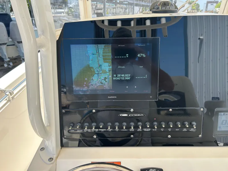 Slide: The Image of Garmin navigation system on Cobia 262 Center Console 2022 boat. - 13