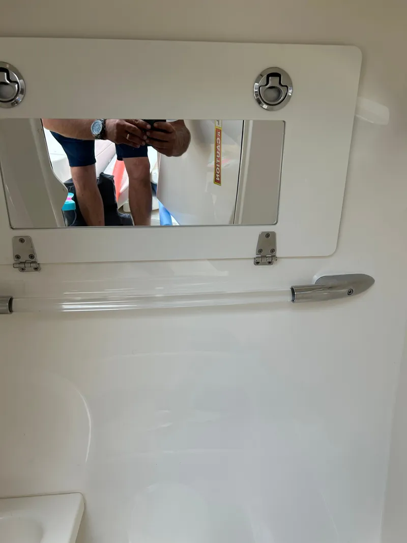 Slide: The Image of Interior of 2022 Cobia 262 Center Console with mirror. - 16