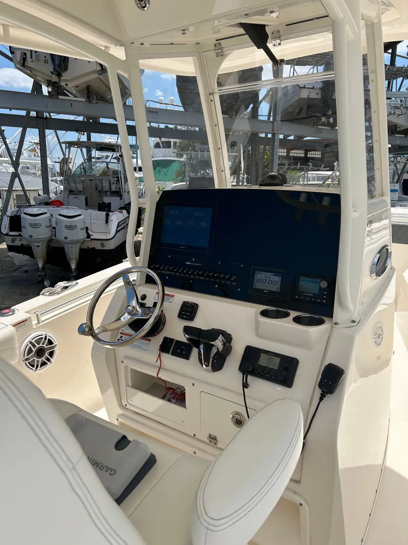 Slide: The Image of Cobia 262 Center Console 2022 helm with modern electronics. - 22