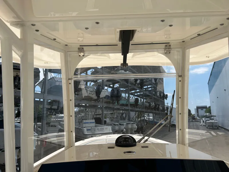 Slide: The Image of Interior view of a 2022 Cobia 262 Center Console boat at the marina. - 27