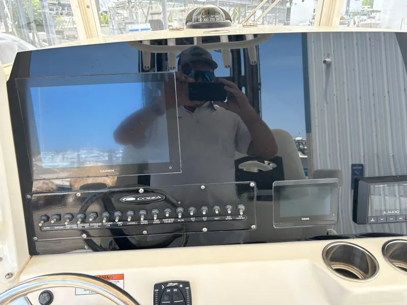 Slide: The Image of Cobia 262 Center Console 2022 with Garmin display and control panel. - 28