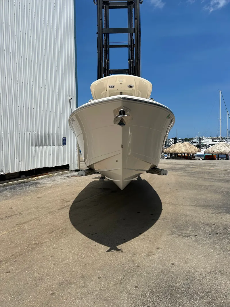 Slide: The Image of 2022 Cobia 262 Center Console boat at shipyard. - 3