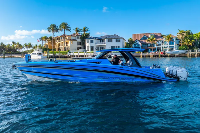 The Image of 2026 Concept 44' Open Deck boat on water near coastal homes. - 0