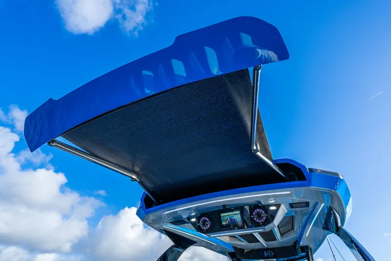 Slide: The Image of 2026 Concept 44' Open Deck boat with open canopy against blue sky. - 30