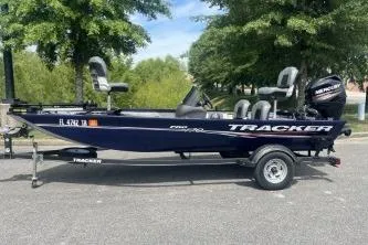 The Image of 2019 Tracker Pro 170 boat on trailer, parked outdoors with trees in the background. - 1
