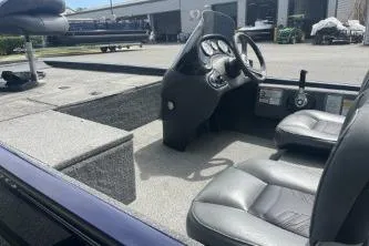 Slide: The Image of 2019 Tracker Pro 170 boat interior with steering console and seating. - 9