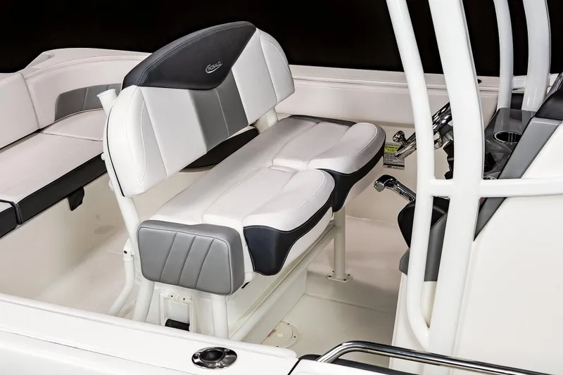 Slide: The Image of Manufacturer Provided Image: 2023 Robalo R242 Explorer boat seating and helm area. - 14