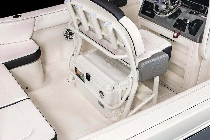 Slide: The Image of Manufacturer Provided Image: 2023 Robalo R242 Explorer boat interior with seating and storage. - 15