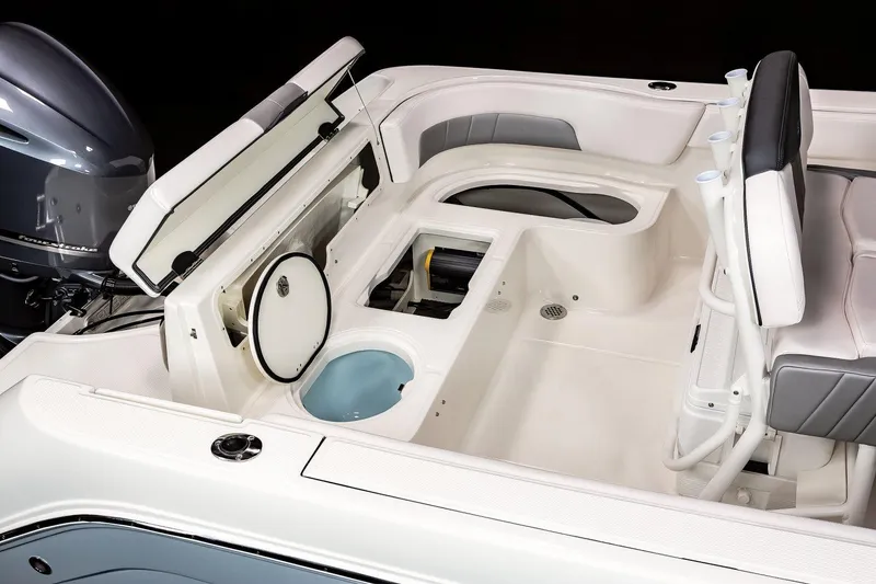 Slide: The Image of Manufacturer Provided Image: 2023 Robalo R242 Explorer boat interior with storage compartments and seating. - 18