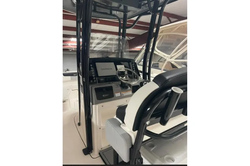 Slide: The Image of 2023 Robalo R242 Explorer boat cockpit with Garmin navigation system. - 3