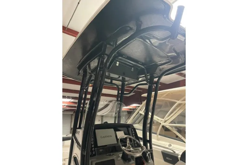 Slide: The Image of 2023 Robalo R242 Explorer boat console with Garmin navigation system. - 4