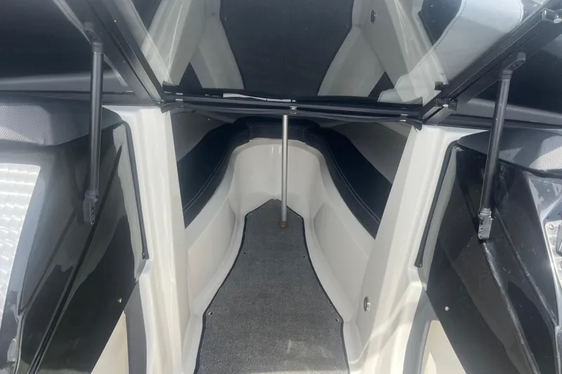 Slide: The Image of Interior view of a 2013 Larson LSR 2300 I/O boat cabin with open hatch. - 11