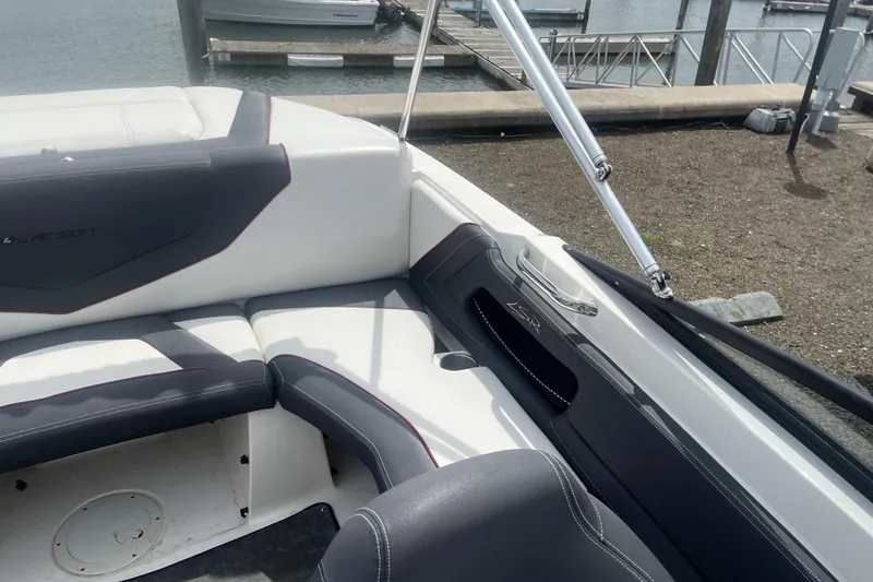 Slide: The Image of Interior view of a 2013 Larson LSR 2300 I/O boat with sleek seating design. - 12