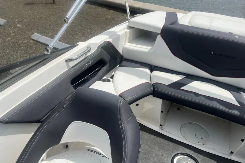 Slide: The Image of 2013 Larson LSR 2300 I/O boat interior with sleek seating and modern design. - 13