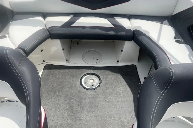 Slide: The Image of Interior seating of 2013 Larson LSR 2300 I/O boat with black and white upholstery. - 14
