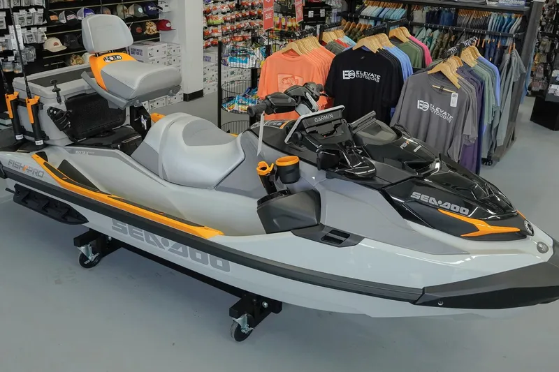 The Image of 2026 Sea-Doo FishPro Trophy 170 jet ski displayed in a store with fishing gear. - 1