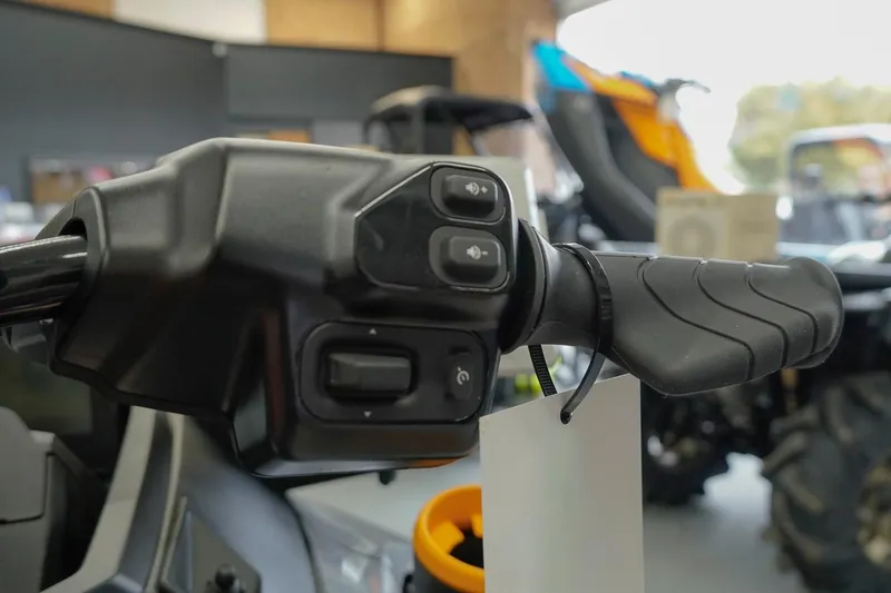 Slide: The Image of Handlebar controls of 2026 Sea-Doo FishPro Trophy 170, featuring ergonomic design and buttons. - 14