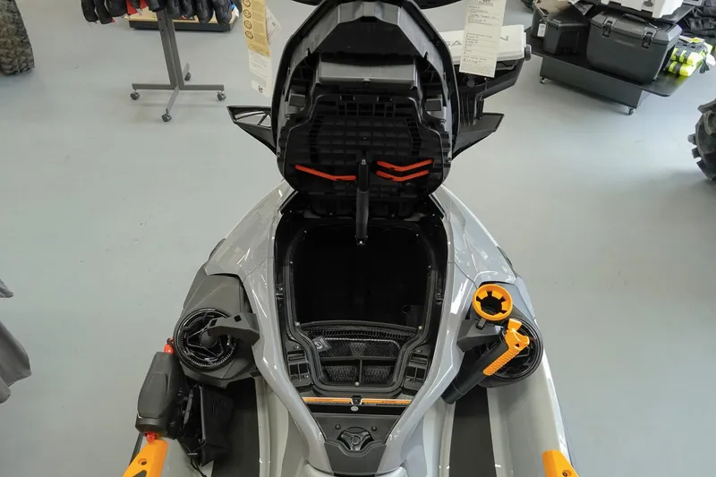 Slide: The Image of 2026 Sea-Doo FishPro Trophy 170 with open storage compartment in showroom. - 15