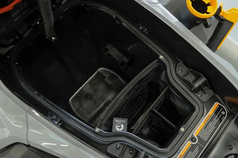 Slide: The Image of Interior storage compartment of 2026 Sea-Doo FishPro Trophy 170, featuring organized space and safety labels. - 17