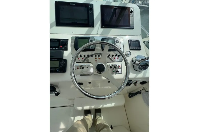 Slide: The Image of Helm of 2008 Cabo 32 Express boat with navigation equipment and steering wheel. - 14