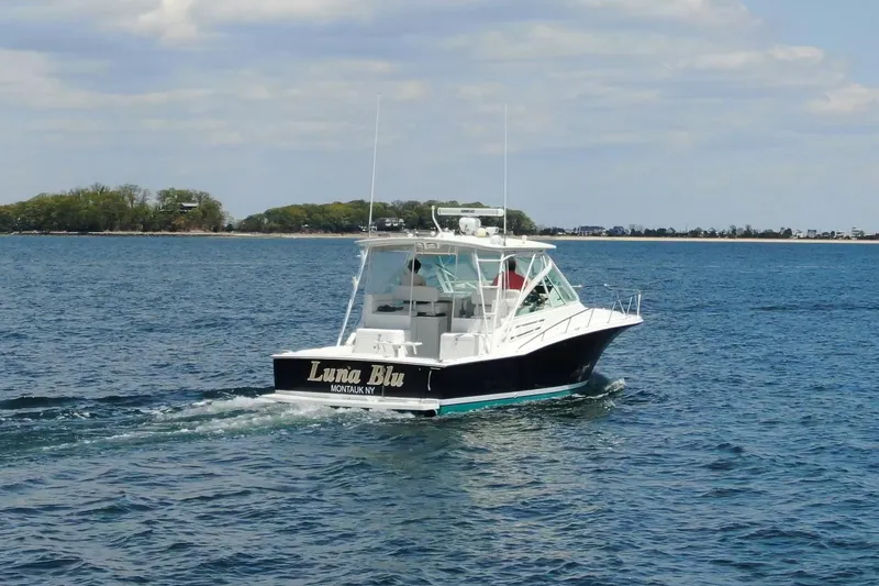 Slide: The Image of 2008 Cabo 32 Express boat "Luna Blu" cruising on open water near Montauk, NY. - 3