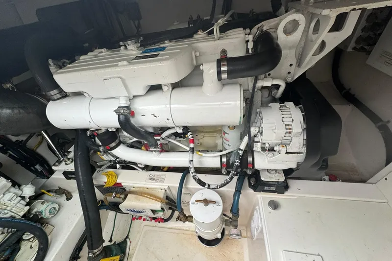Slide: The Image of Engine compartment of a 2008 Cabo 32 Express boat, showcasing mechanical components. - 31