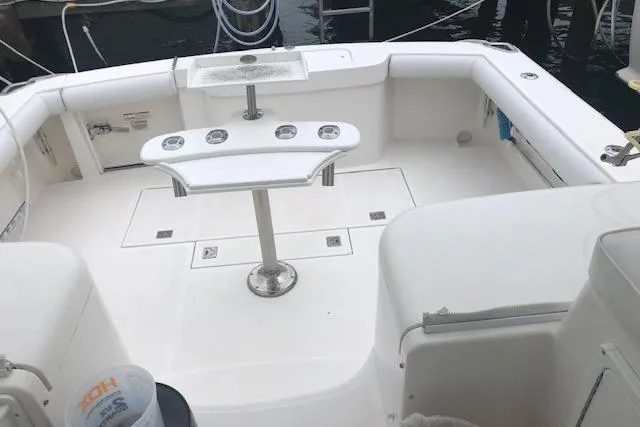 Slide: The Image of Spacious deck of 2008 Cabo 32 Express boat with fishing rod holders. - 6