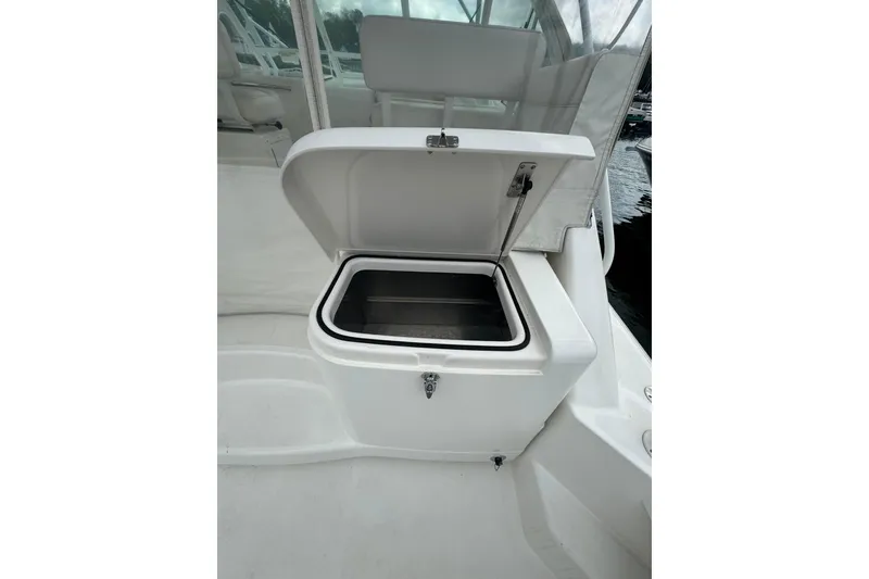 Slide: The Image of Open storage compartment on 2008 Cabo 32 Express boat deck. - 9