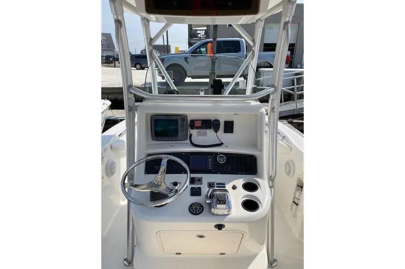 Slide: The Image of Boston Whaler 240 Outrage 2007 boat console with steering wheel and navigation equipment. - 3