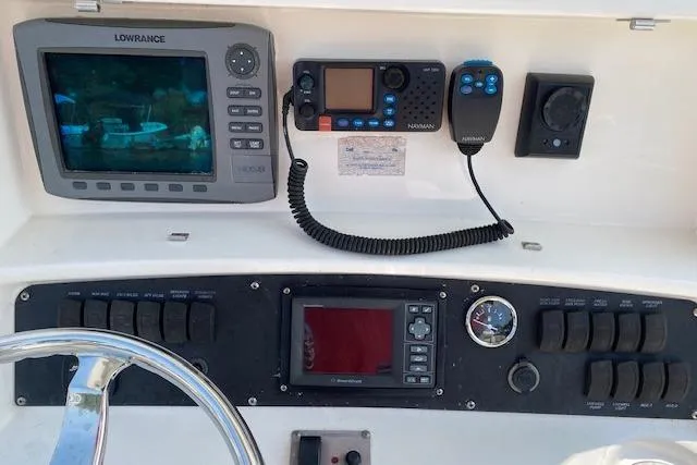 Slide: The Image of Dashboard of a 2007 Boston Whaler 240 Outrage with navigation and communication equipment. - 4