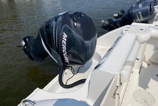 Slide: The Image of 2007 Boston Whaler 240 Outrage with Mercury outboard engine on calm water. - 6