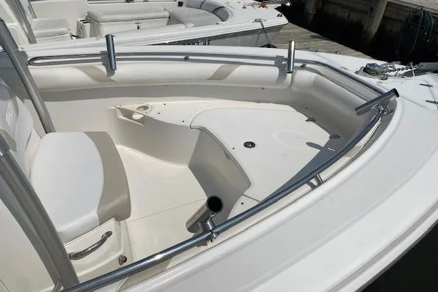 Slide: The Image of 2007 Boston Whaler 240 Outrage boat interior with seating and stainless steel railings. - 7