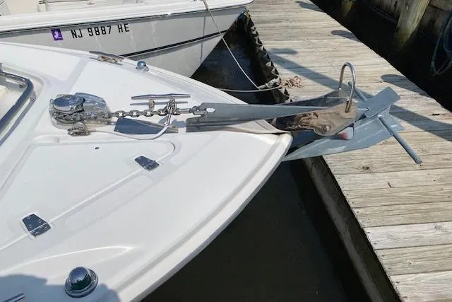Slide: The Image of 2007 Boston Whaler 240 Outrage boat with anchor and chain at dock. - 9